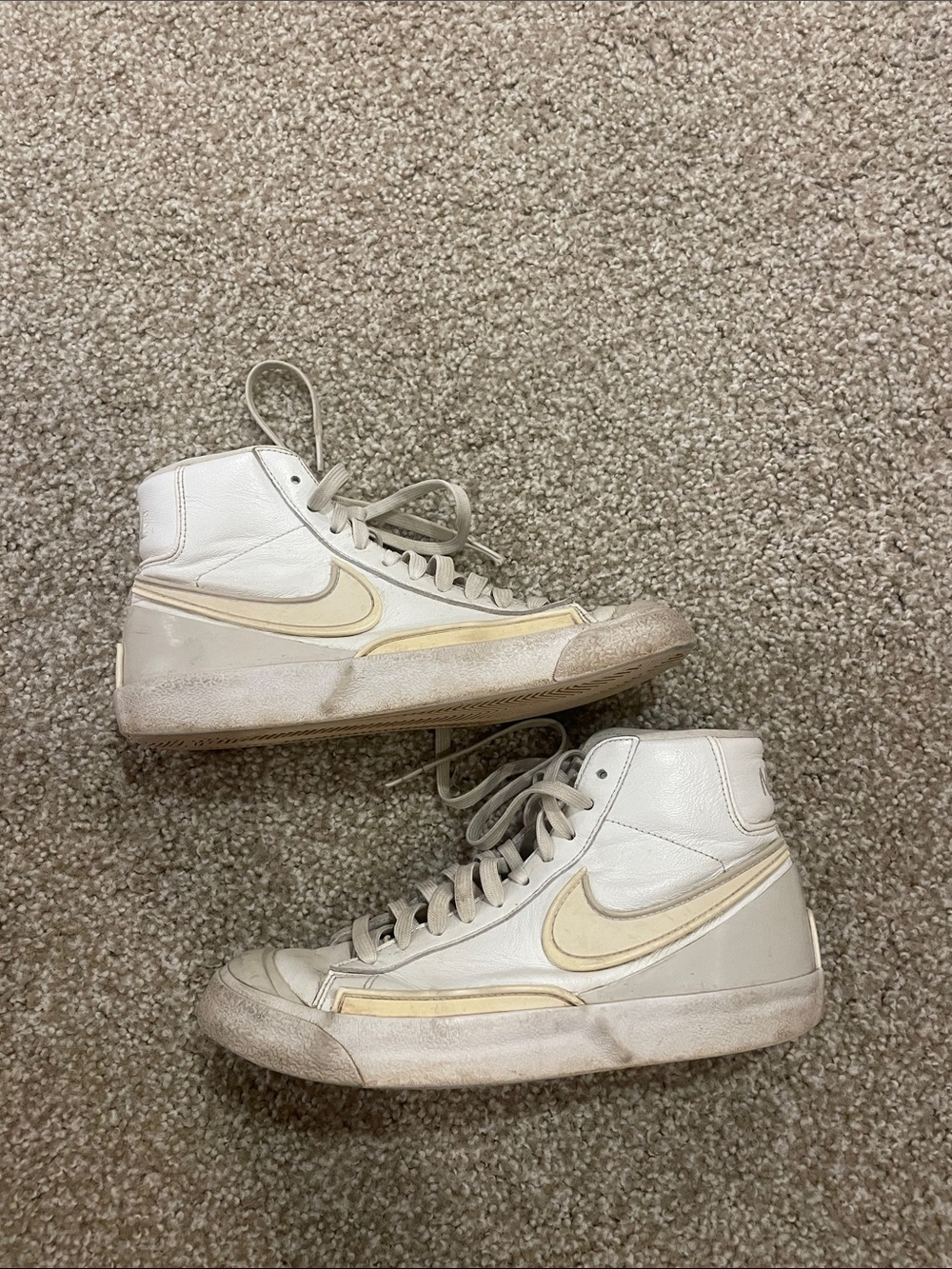 Nike White High-Top Sneakers with Cream Swoosh